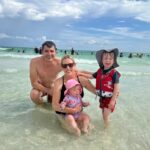Image of the author's family in the water in Destin, Florida
